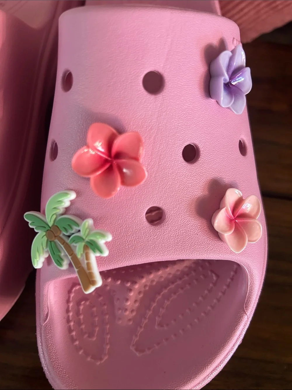 Crocs Pink stomp slides with charms